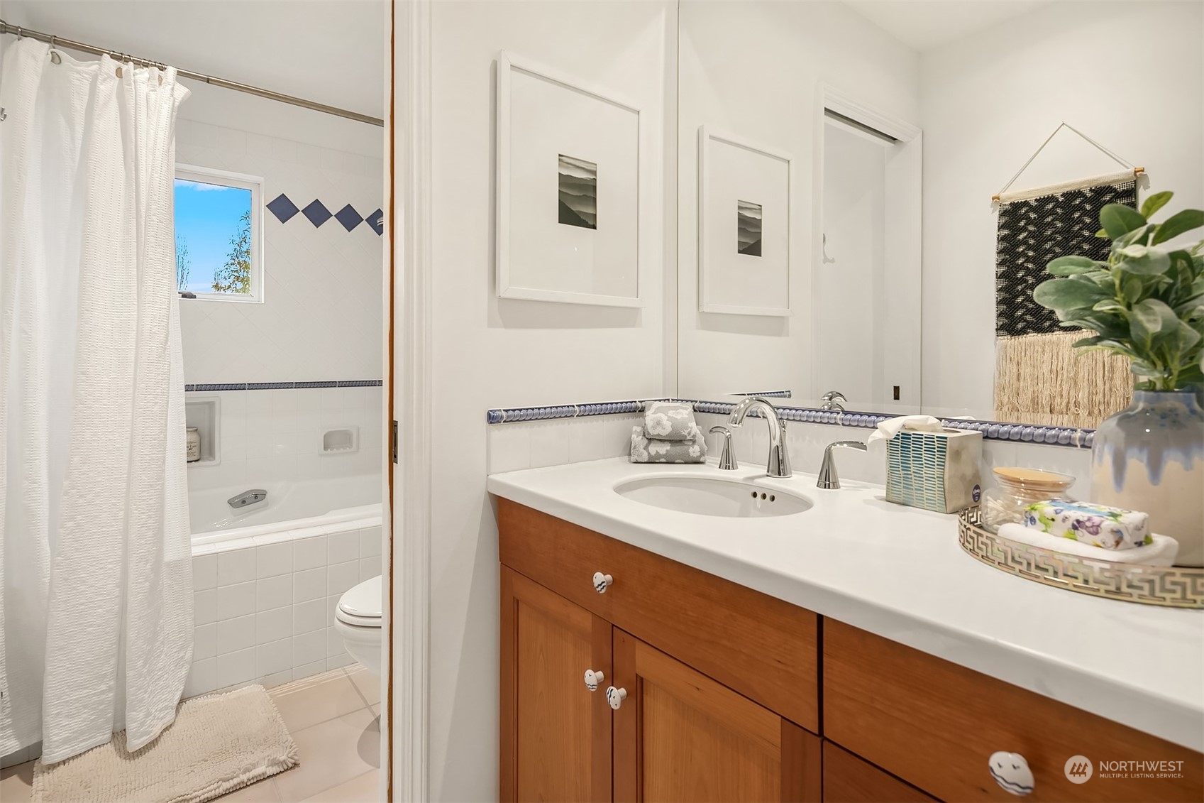 1925 East Lynn Street Seattle, WA 98112 - Photo 24 of 36 a bathroom with a granite countertop sink a toilet and shower