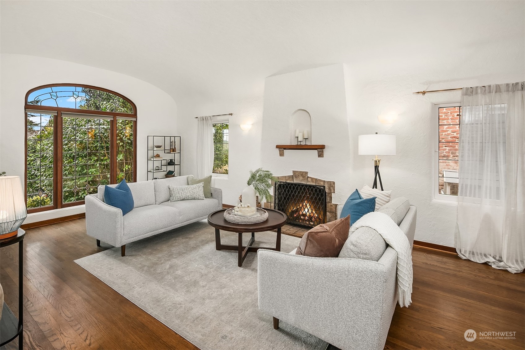 1925 East Lynn Street Seattle, WA 98112 - Photo 4 of 36 a living room with furniture and a fireplace