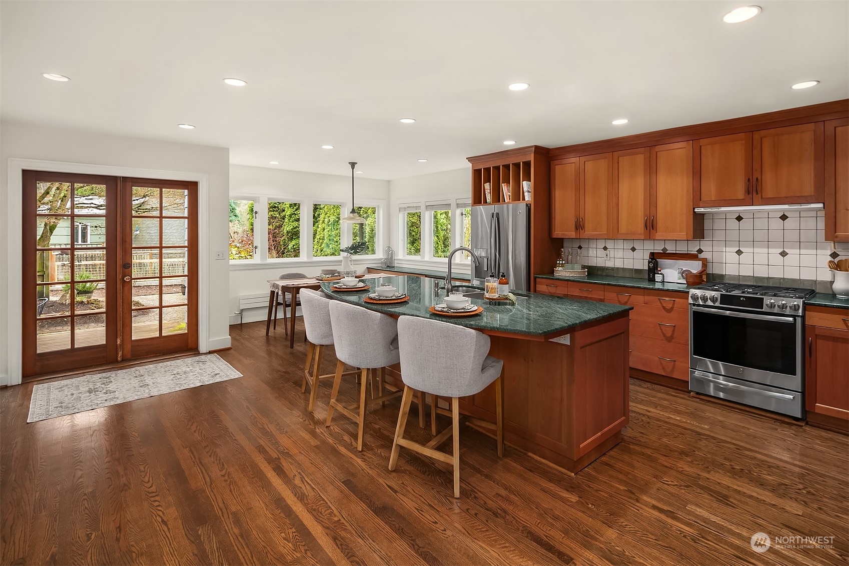 1925 East Lynn Street Seattle, WA 98112 - Photo 10 of 36 a large kitchen with lots of counter space a sink and chairs