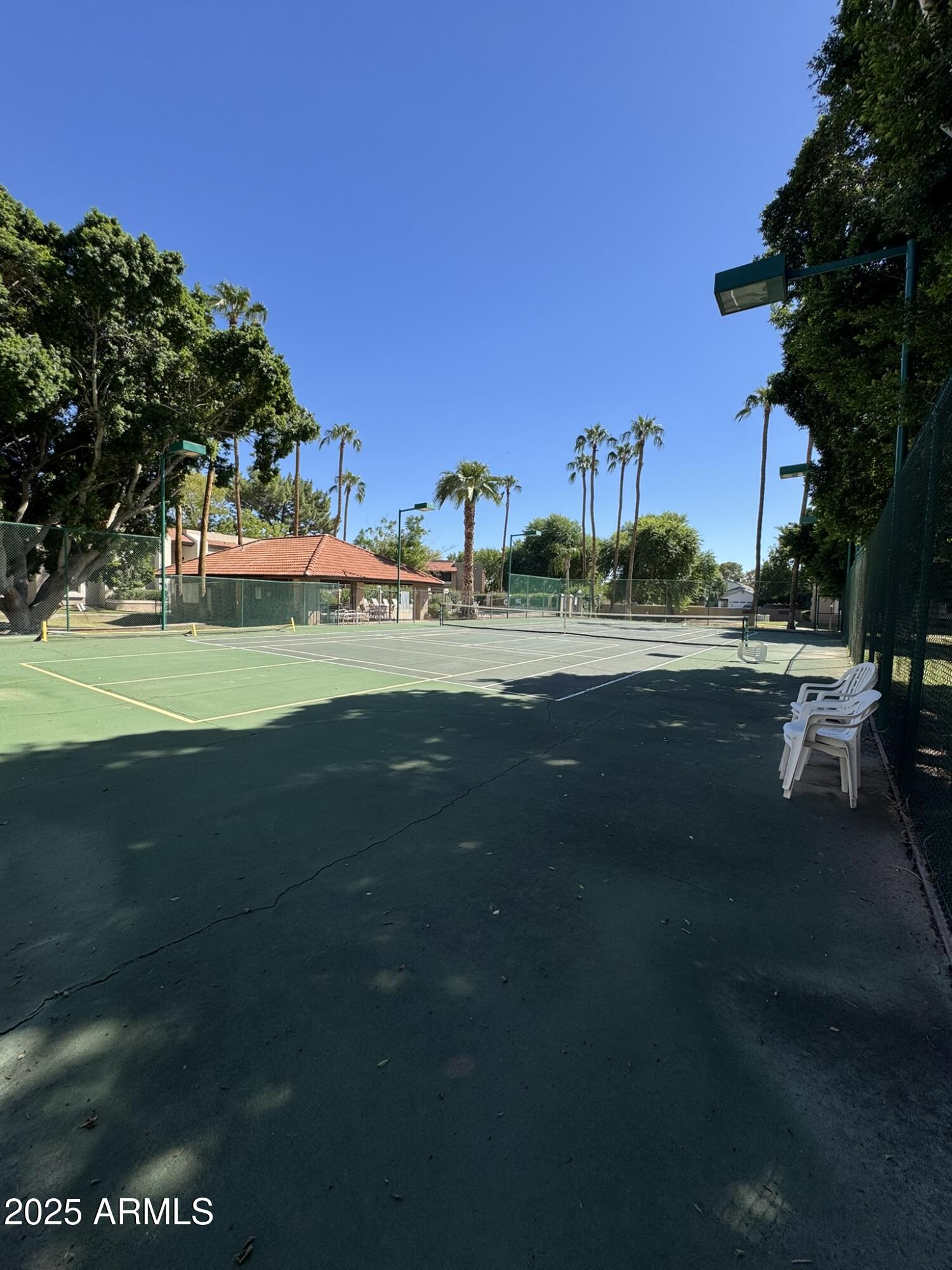 2146 West Isabella Avenue, Unit 213 Mesa, AZ 85202 - Photo 11 of 13 a view of grassy field with building and trees in the background