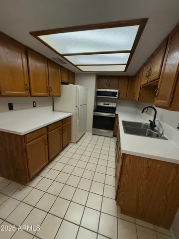 a kitchen with a sink and cabinets
