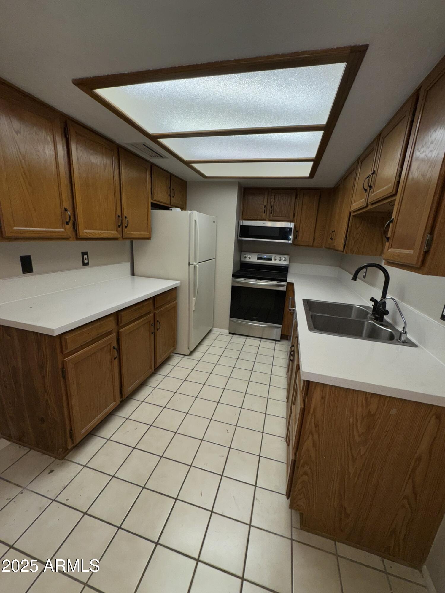 2146 West Isabella Avenue, Unit 213 Mesa, AZ 85202 - Photo 8 of 13 a kitchen with a sink and cabinets