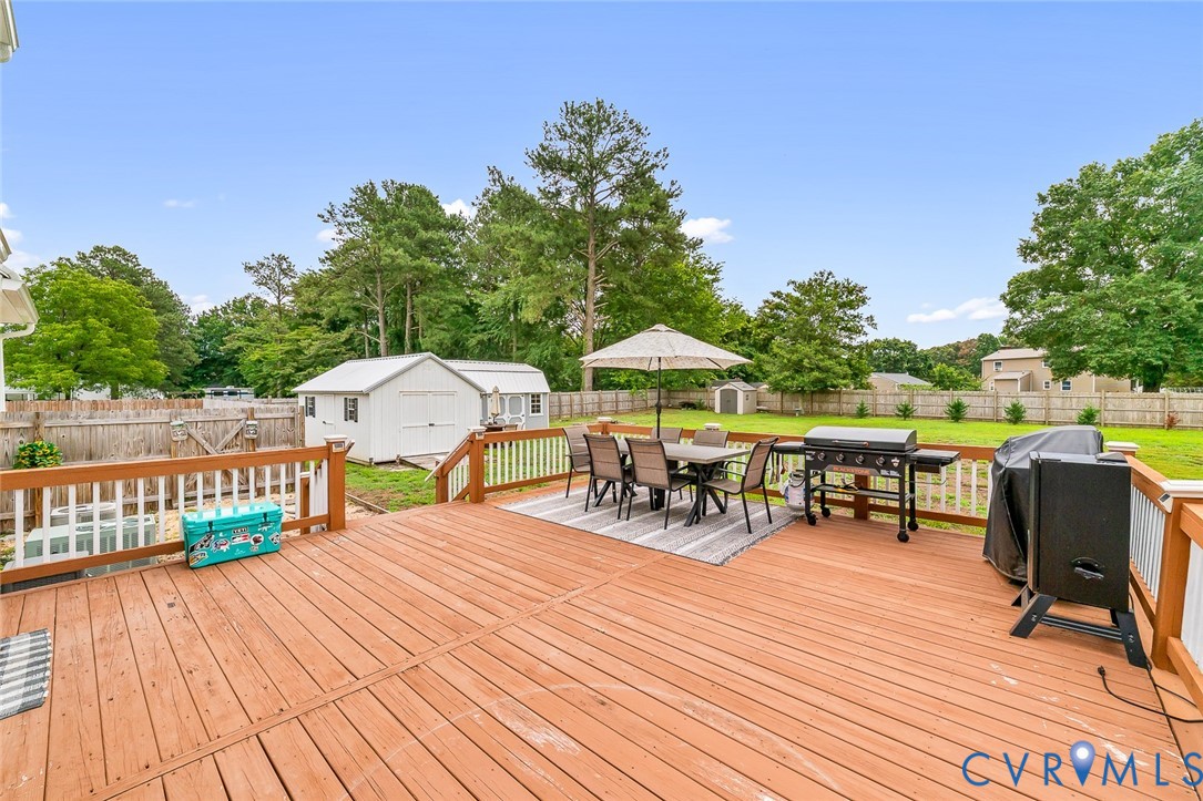 234 Poplar Road Aylett, VA 23009 - Photo 24 of 31 Spacious wood-finish deck with white balusters and