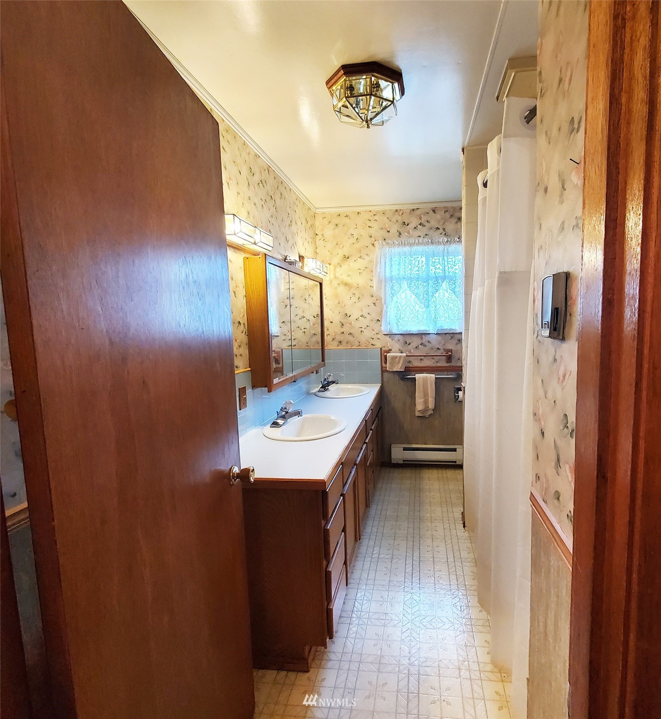 12890 Pulver Road Burlington, WA 98233 - Photo 11 of 18 a view of a bathroom with a sink and a mirror
