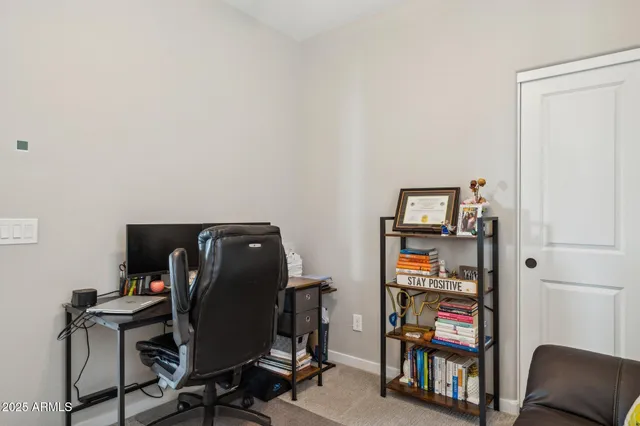 a view of a livingroom with furniture and windows