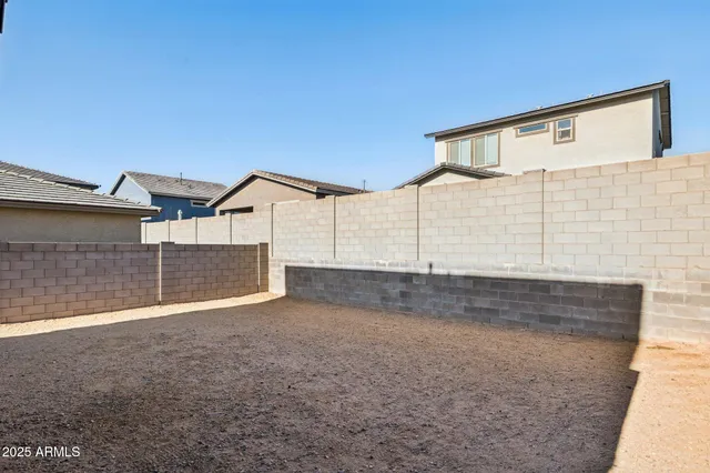 a view of a workspace with furniture and a book shelf