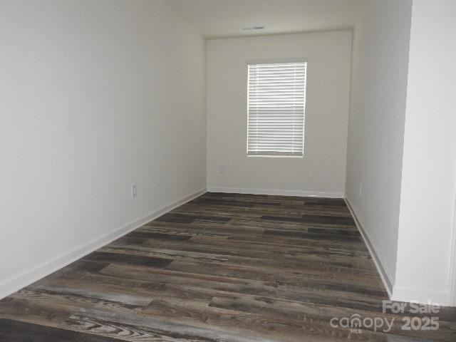 252 Mills Avenue Troutman, NC 28166 - Photo 11 of 15 a view of a room with wooden floor and window