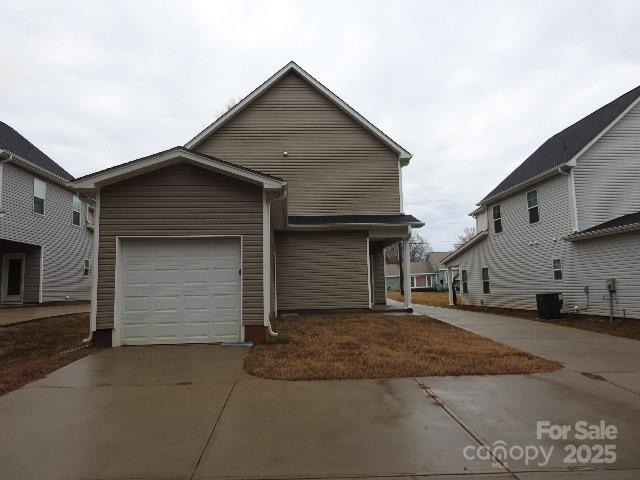 252 Mills Avenue Troutman, NC 28166 - Photo 2 of 15 a front view of a house with a garage