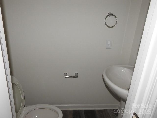 252 Mills Avenue Troutman, NC 28166 - Photo 10 of 15 a bathroom with a toilet and a sink