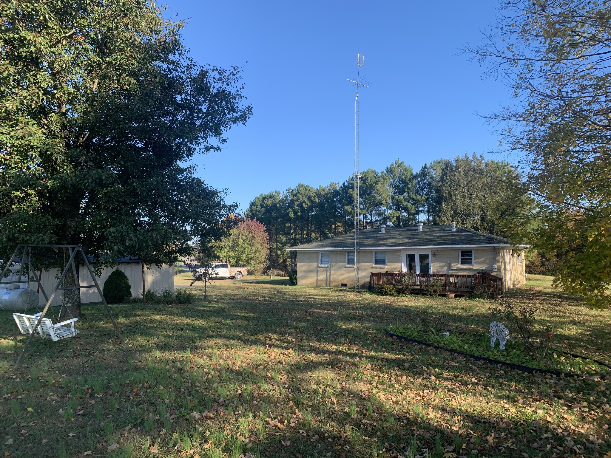341 Busby Road Loretto, TN 38469 - Photo 20 of 42 a view of a house with a yard