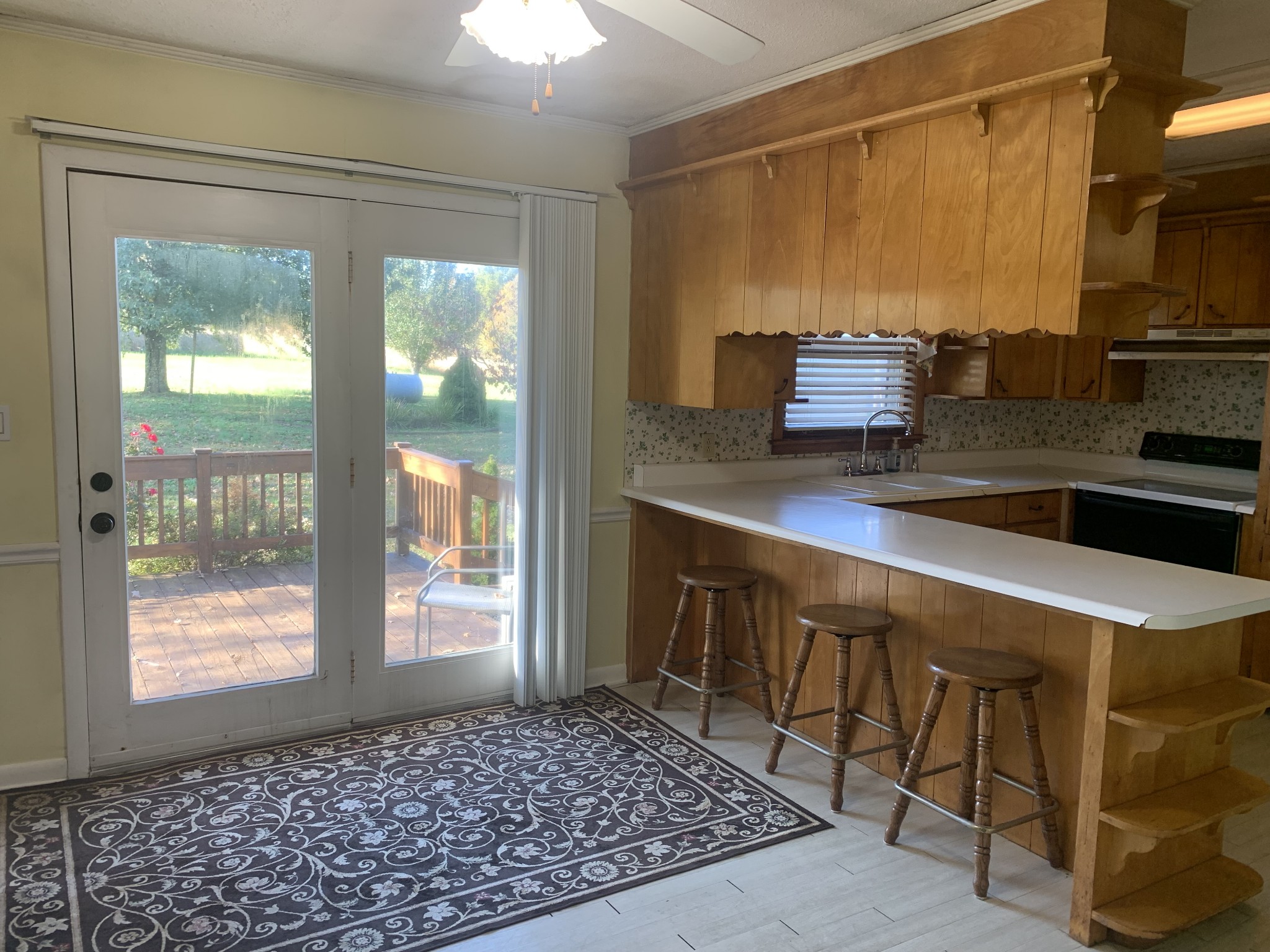 341 Busby Road Loretto, TN 38469 - Photo 33 of 42 a kitchen with stainless steel appliances a stove a sink and a microwave