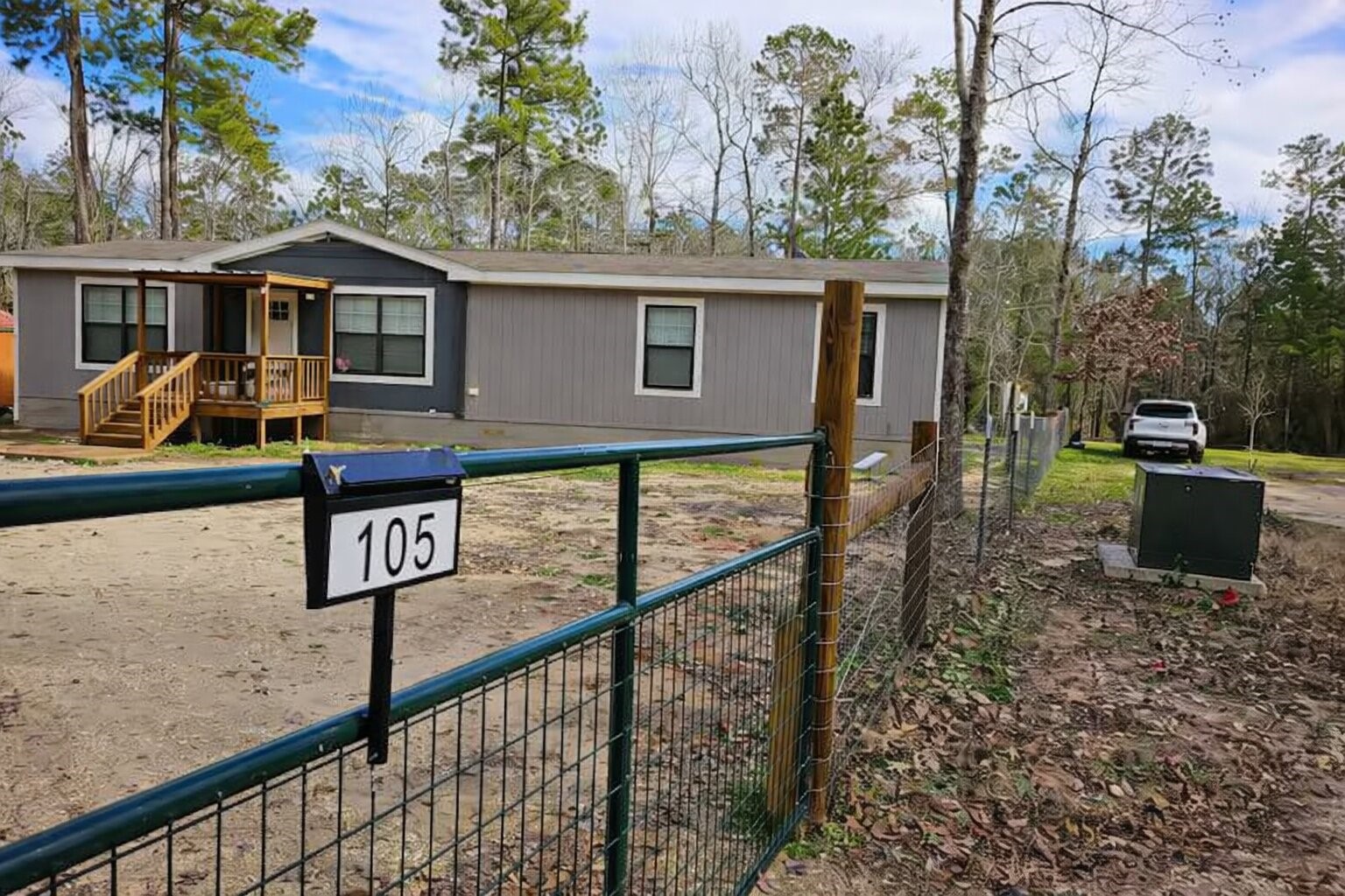105 Saddle Surrey Road Coldspring, TX 77331 - Photo 2 of 48 a front view of a house with yard