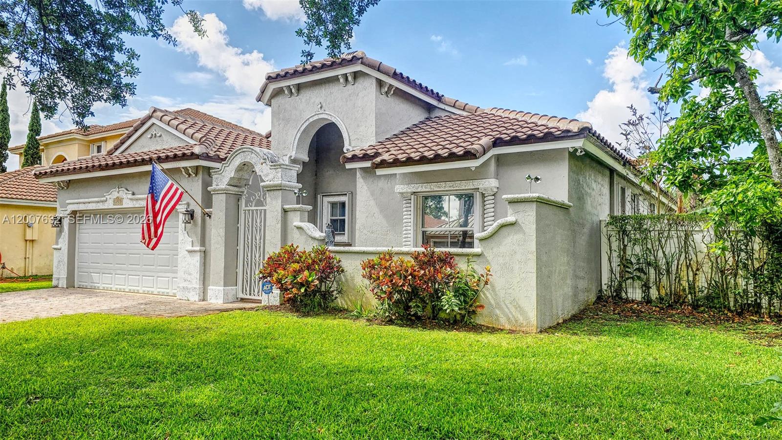 a front view of a house with garden