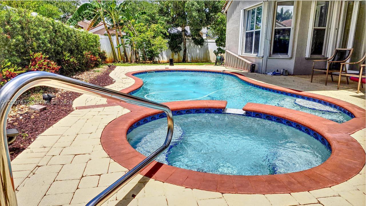 18920 Southwest 29th Street Miramar, FL 33029 - Photo 2 of 6 a view of swimming pool from a balcony