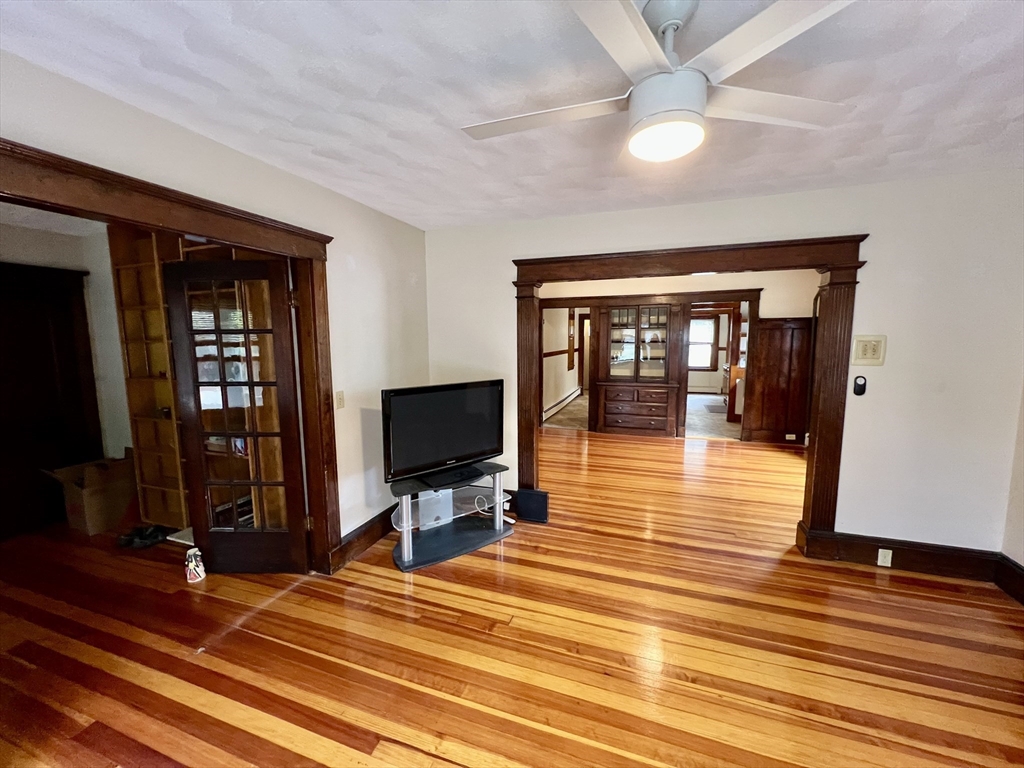 40 Copley Street, Unit 1 Cambridge, MA 02138 - Photo 1 of 21 a room with wooden floor and furniture