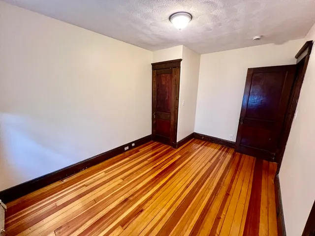 a bathroom with a glass door shower and a sink