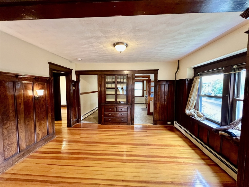 40 Copley Street, Unit 1 Cambridge, MA 02138 - Photo 4 of 21 a view of lobby with an empty room and wooden floor