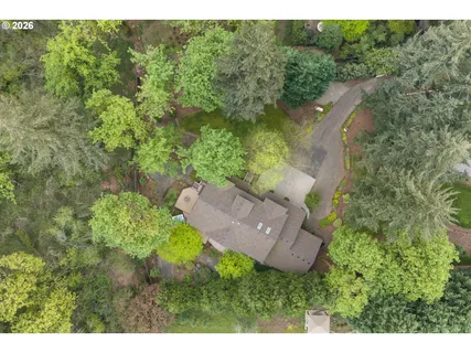 a view of house with a yard