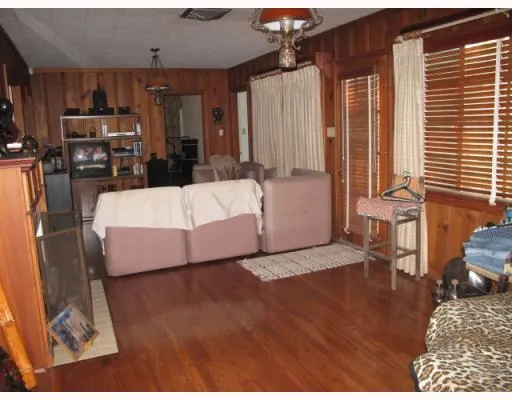 a bed room with a bed and a television