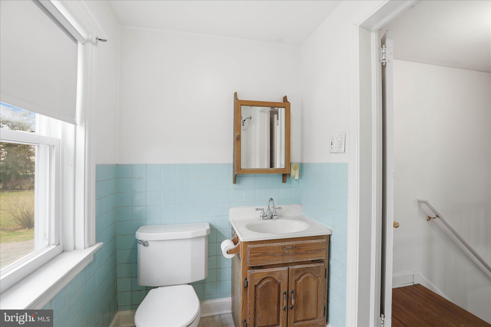 1632 Lampeter Road Lancaster, PA 17602 - Photo 20 of 46 a bathroom with a toilet sink and mirror