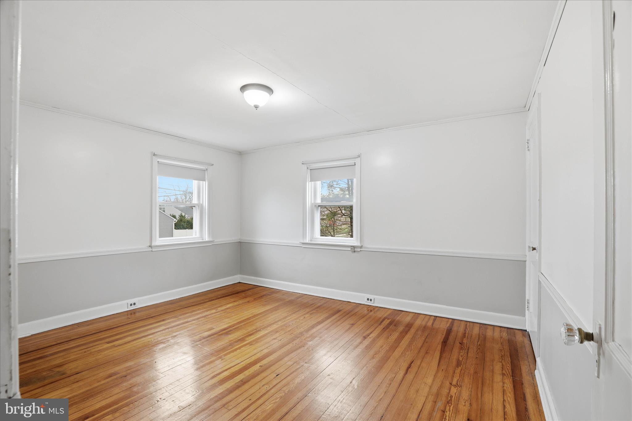 1632 Lampeter Road Lancaster, PA 17602 - Photo 28 of 46 an empty room with wooden floor and windows