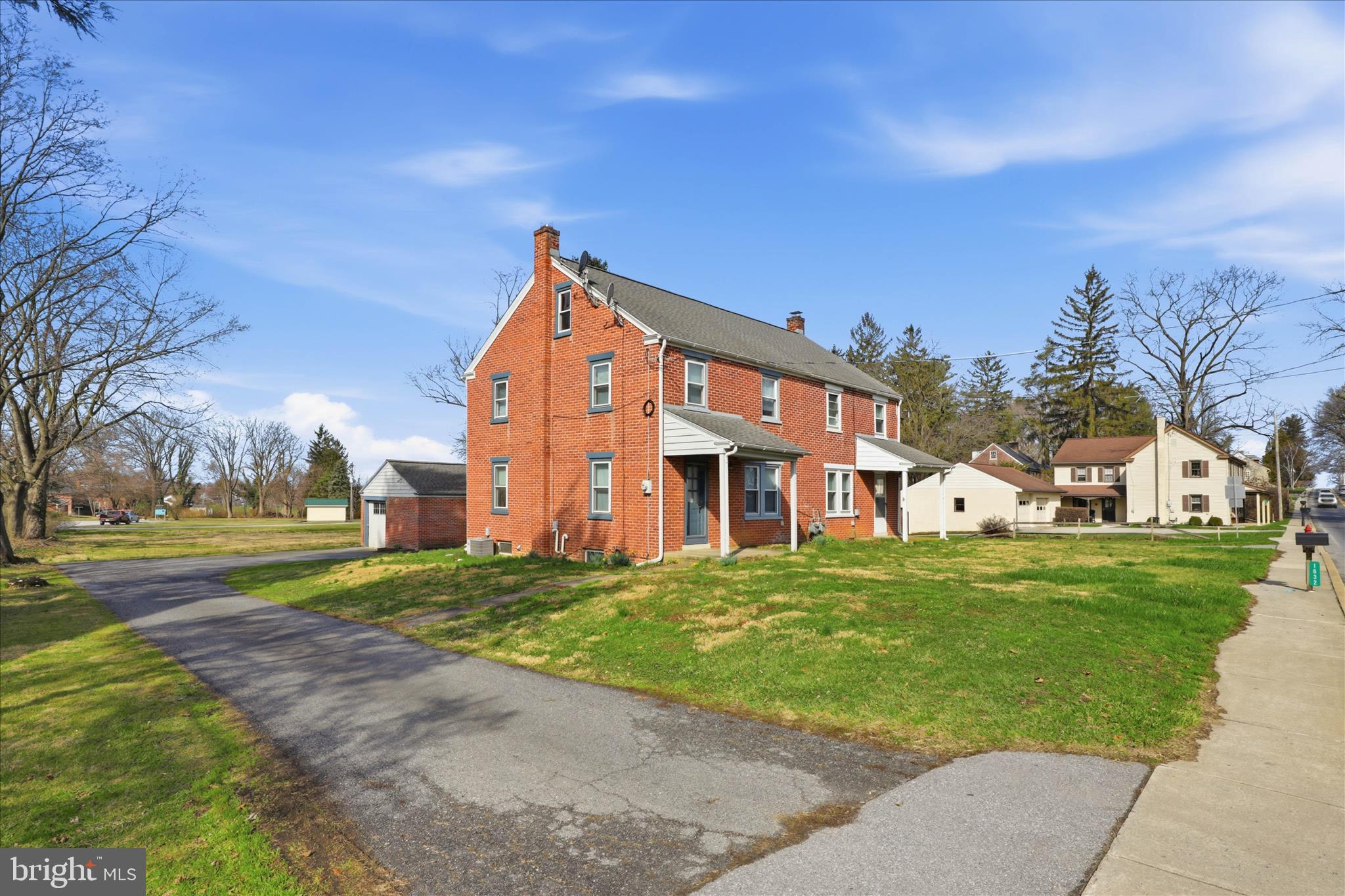 1632 Lampeter Road Lancaster, PA 17602 - Photo 3 of 46 a view of a big house with a big yard and large trees
