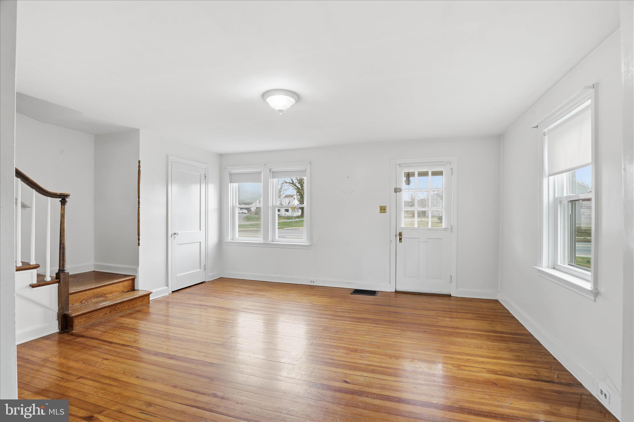 1632 Lampeter Road Lancaster, PA 17602 - Photo 10 of 46 an empty room with wooden floor and windows