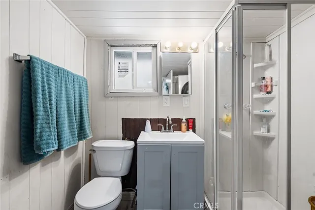 a bathroom with a toilet sink and shower