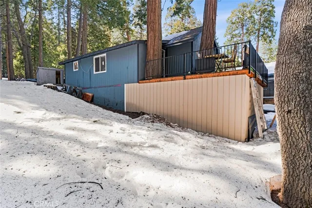 a backyard of a house with wooden fence