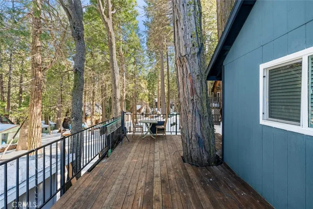 a view of a balcony with wooden floor