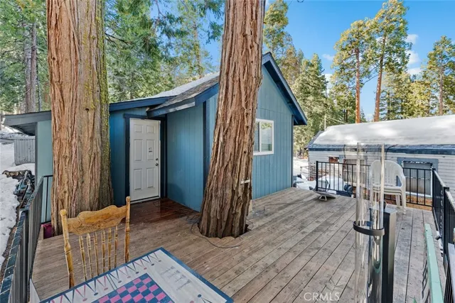 a view of balcony with wooden floor and outdoor seating