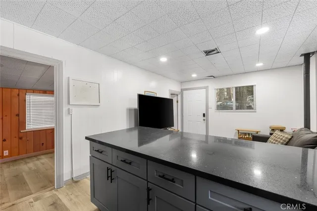 a kitchen with a sink and a mirror