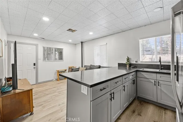 a kitchen with counter top space sink and center island