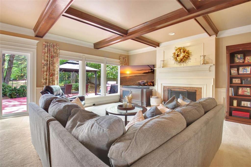 110 Sandtrap Ridge Peachtree City, GA 30269 - Photo 14 of 85 a living room with fireplace furniture and a large window