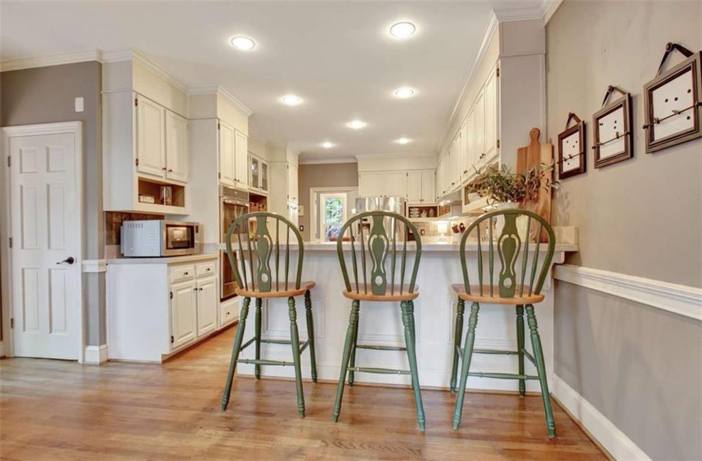 110 Sandtrap Ridge Peachtree City, GA 30269 - Photo 20 of 85 a view of kitchen and dining area with chandelier