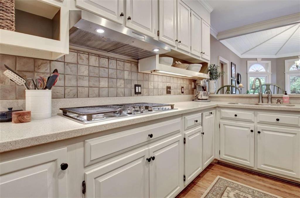 110 Sandtrap Ridge Peachtree City, GA 30269 - Photo 27 of 85 a kitchen with a stove cabinets and a sink