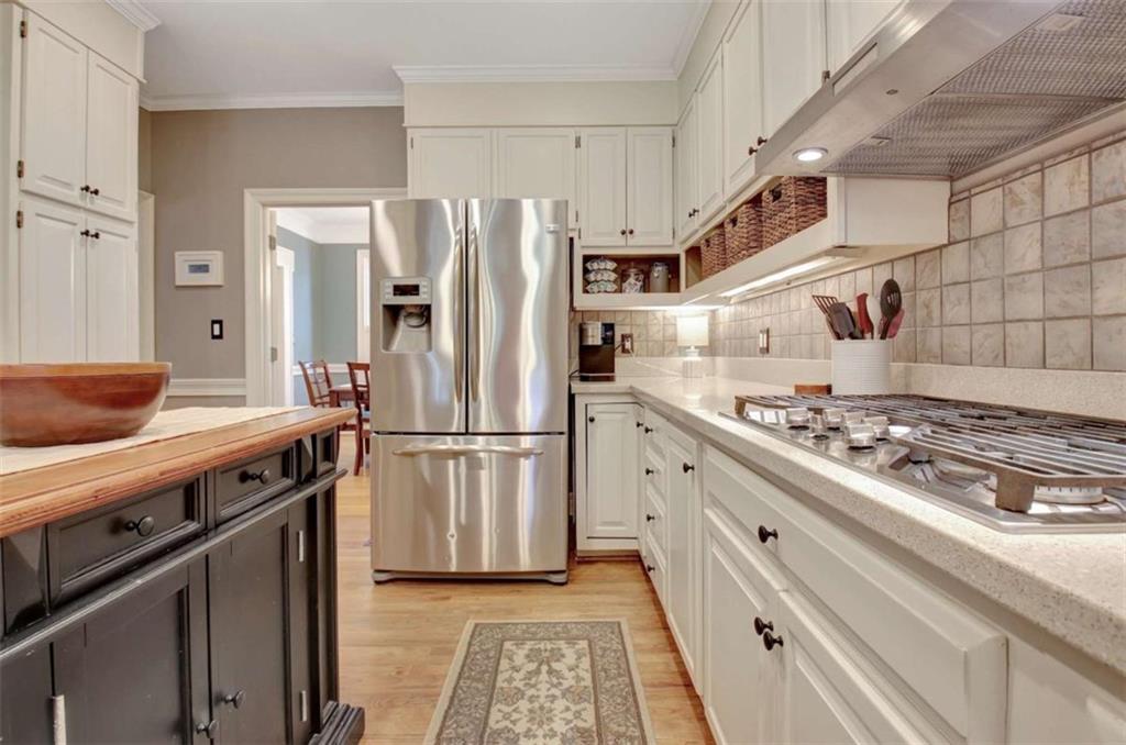 110 Sandtrap Ridge Peachtree City, GA 30269 - Photo 28 of 85 a kitchen with stainless steel appliances granite countertop a refrigerator and a stove