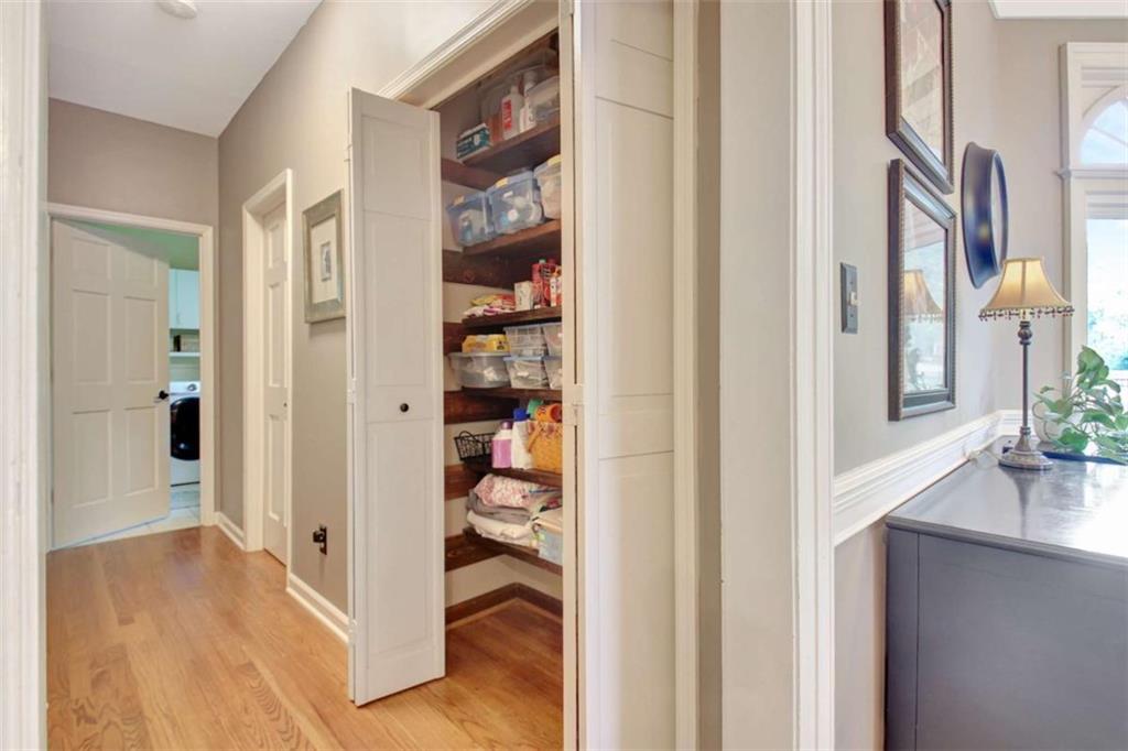 110 Sandtrap Ridge Peachtree City, GA 30269 - Photo 30 of 85 a view of a hallway with wooden floor and dining room
