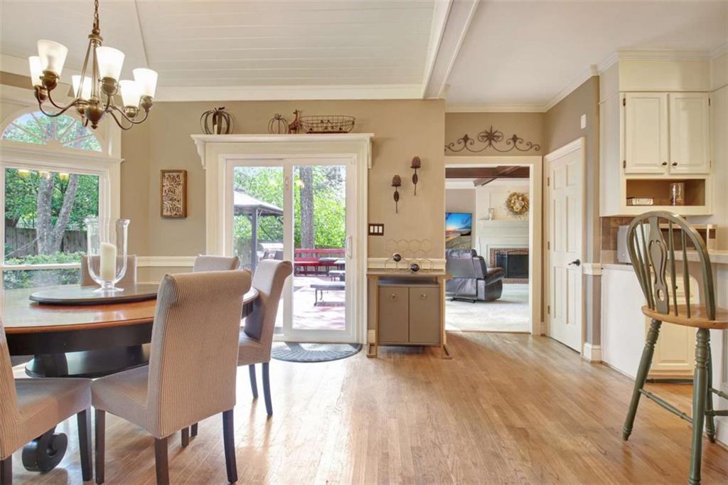 110 Sandtrap Ridge Peachtree City, GA 30269 - Photo 34 of 85 a dining room with furniture a chandelier and wooden floor