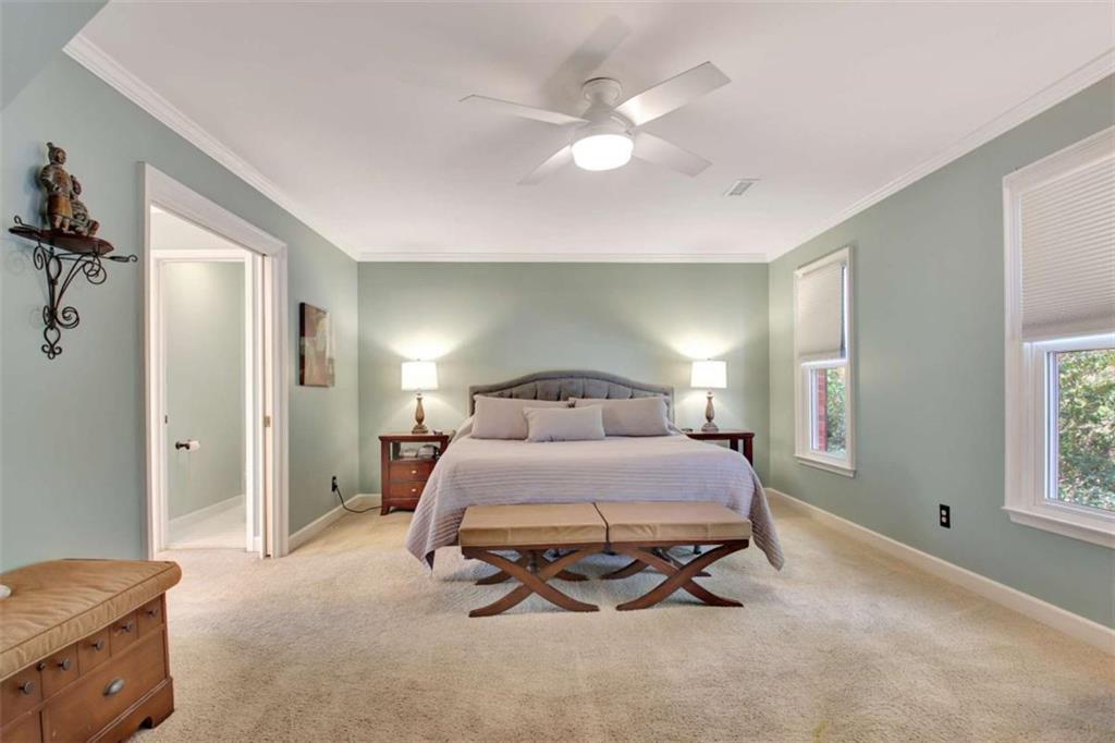 110 Sandtrap Ridge Peachtree City, GA 30269 - Photo 44 of 85 a spacious bedroom with a bed and a window
