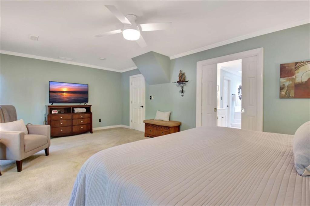 110 Sandtrap Ridge Peachtree City, GA 30269 - Photo 46 of 85 a bedroom with a bed and furniture