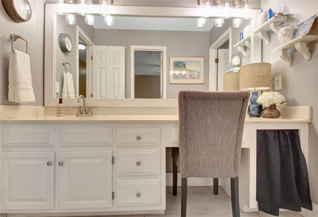 110 Sandtrap Ridge Peachtree City, GA 30269 - Photo 59 of 85 a bathroom with a sink vanity and a mirror