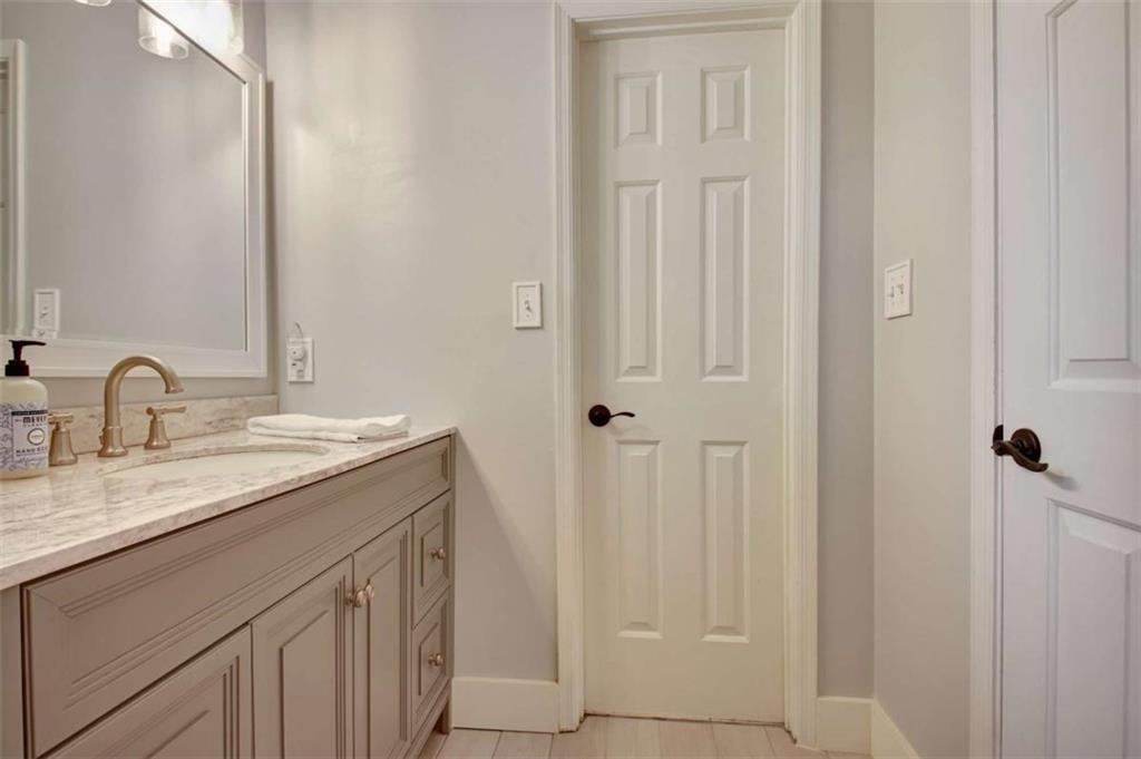 110 Sandtrap Ridge Peachtree City, GA 30269 - Photo 68 of 85 a bathroom with a sink and a mirror
