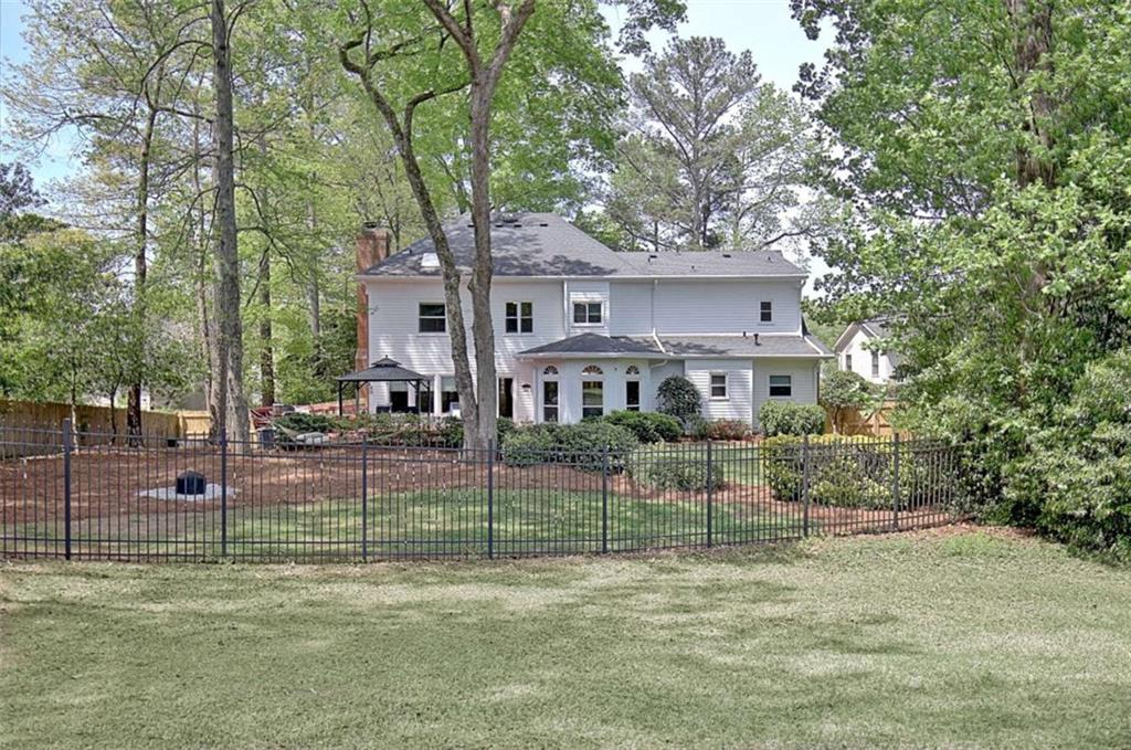 110 Sandtrap Ridge Peachtree City, GA 30269 - Photo 77 of 85 a view of a house and a yard