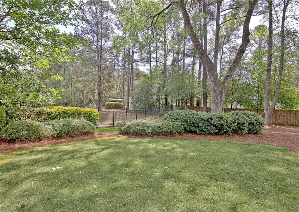 110 Sandtrap Ridge Peachtree City, GA 30269 - Photo 80 of 85 a view of a backyard with large trees