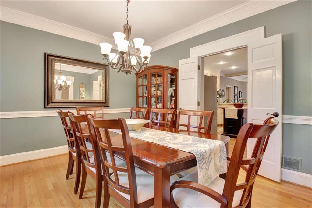 110 Sandtrap Ridge Peachtree City, GA 30269 - Photo 9 of 85 a view of a dining room with furniture wooden floor and chandelier