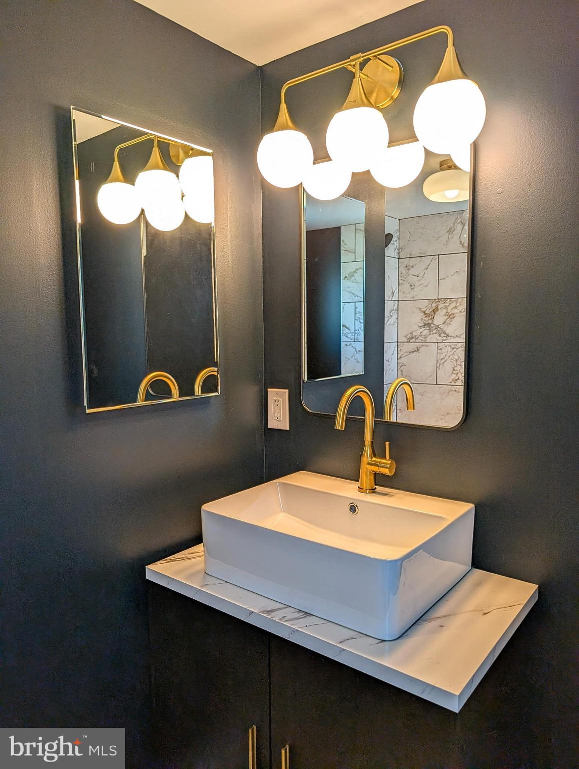 74 Pitman Avenue, Unit B Pitman, NJ 08071 - Photo 13 of 30 a bathroom with a sink and a mirror