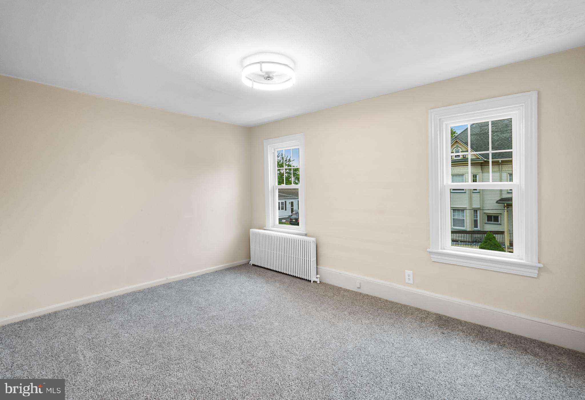74 Pitman Avenue, Unit B Pitman, NJ 08071 - Photo 16 of 30 an empty room with windows