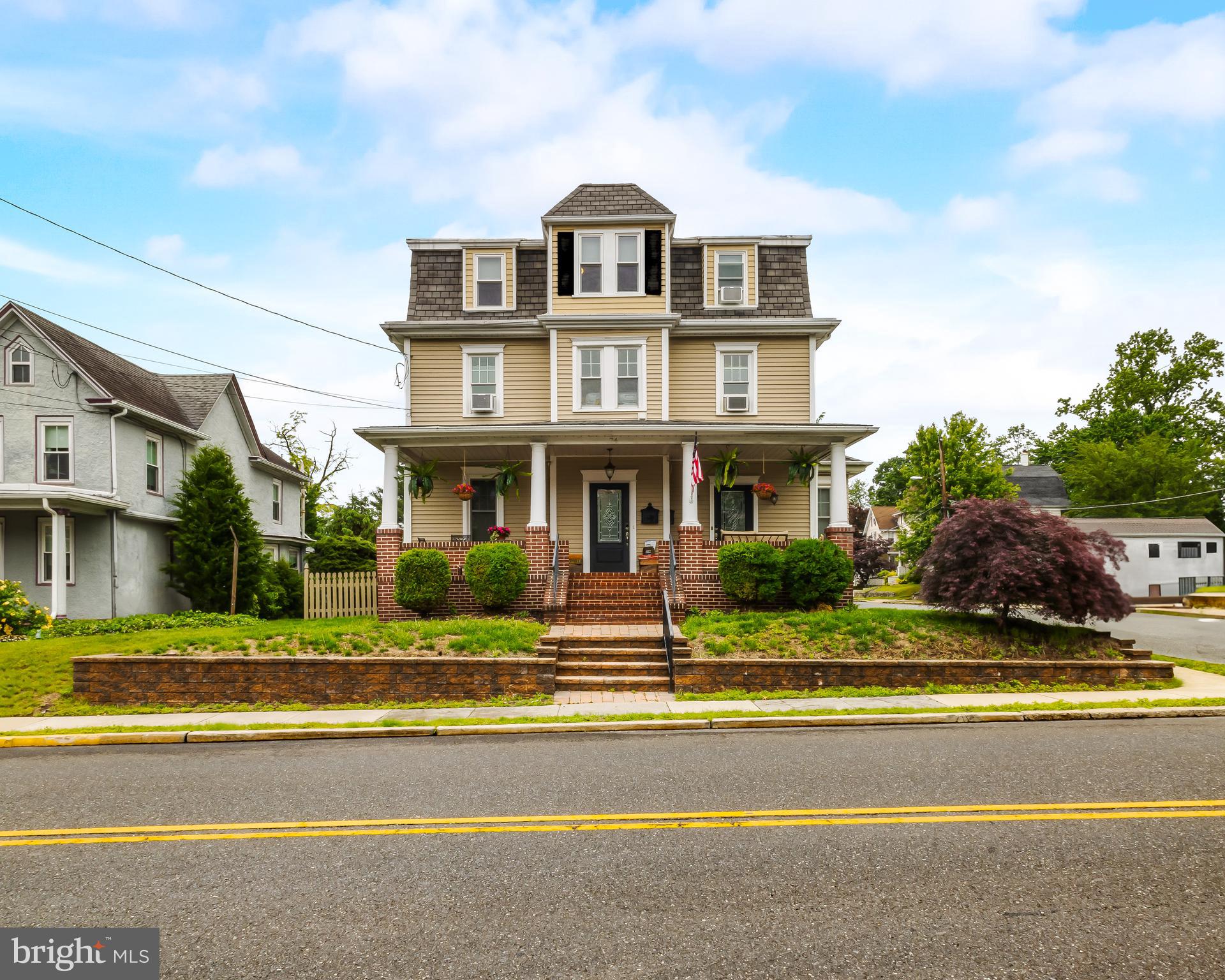 74 Pitman Avenue, Unit B Pitman, NJ 08071 - Photo 30 of 30 a front view of a house with a yard