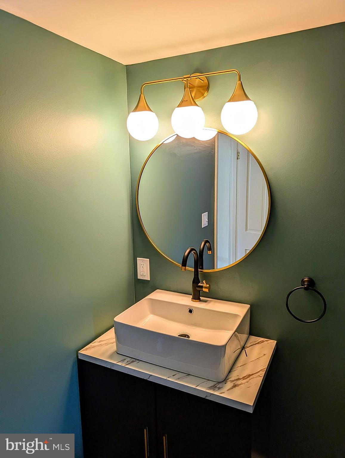 74 Pitman Avenue, Unit B Pitman, NJ 08071 - Photo 7 of 30 a bathroom with a sink and a mirror